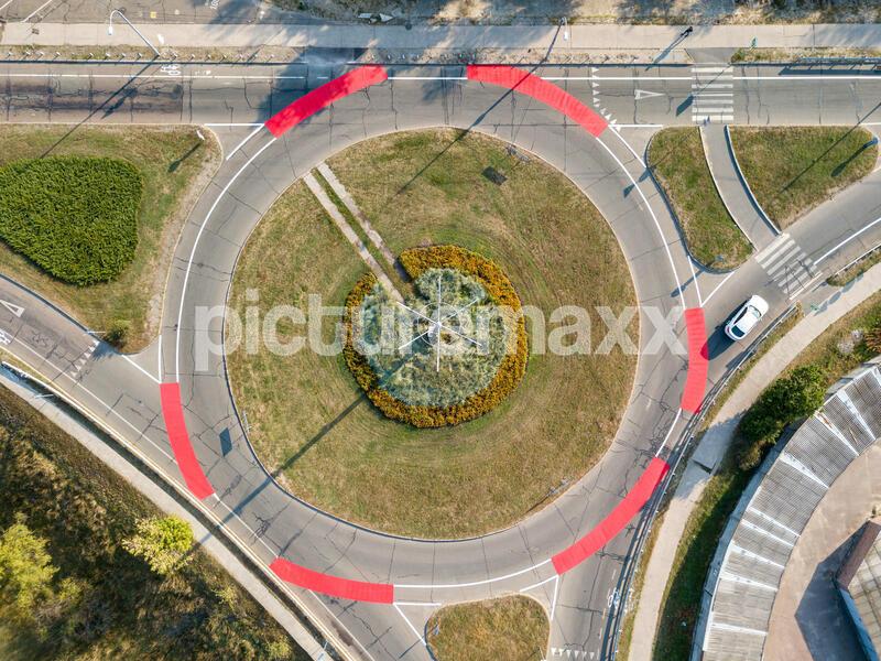 Aerial drone view. Roundabout with red bicycle markings.