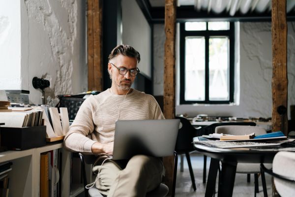 person with a laptop in an office