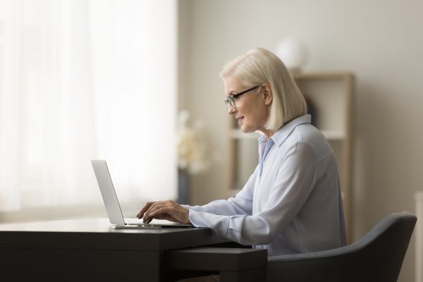 Middle-aged professional working with laptop