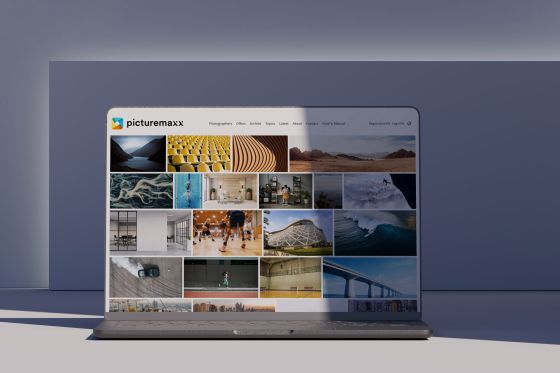 A laptop showcasing a website created with picturemaxx Drupal.