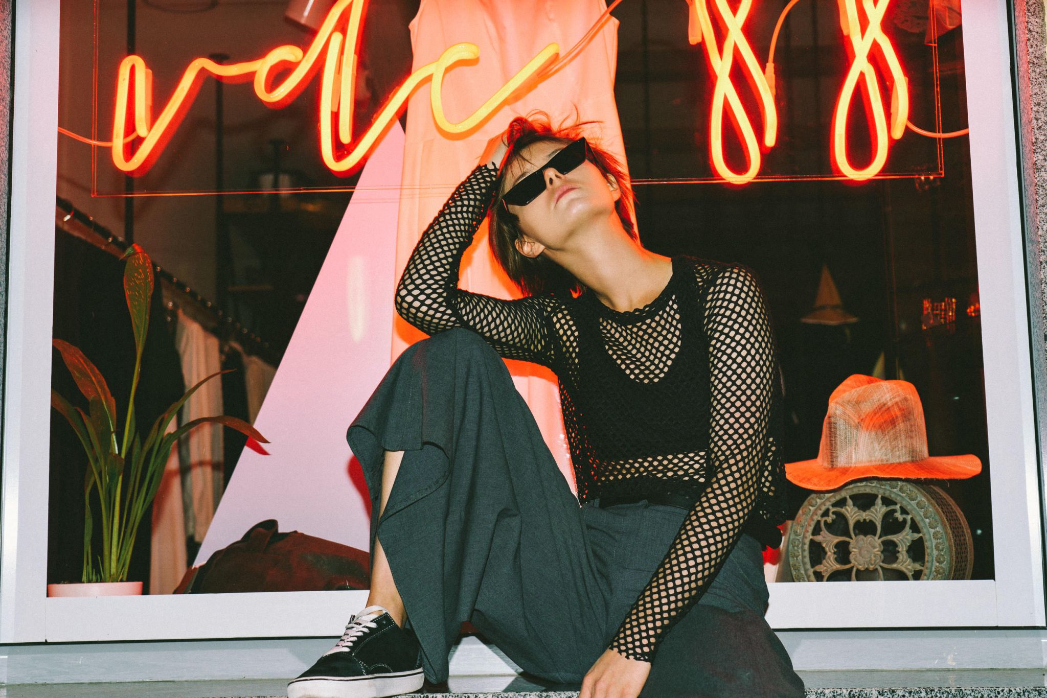 Pretty model advertise trendy clothing big shop window background