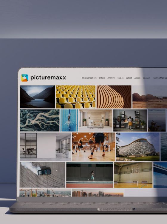 A laptop showcasing a website created with picturemaxx Drupal.